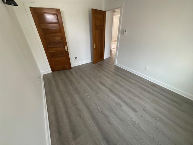 empty room with wood-type flooring