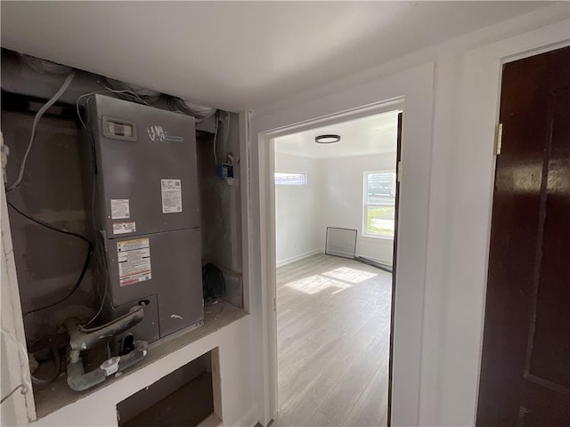 utility room featuring heating unit