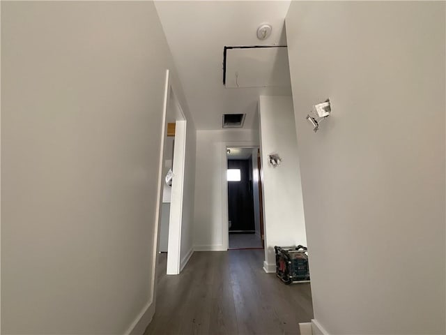 hallway with dark hardwood / wood-style flooring