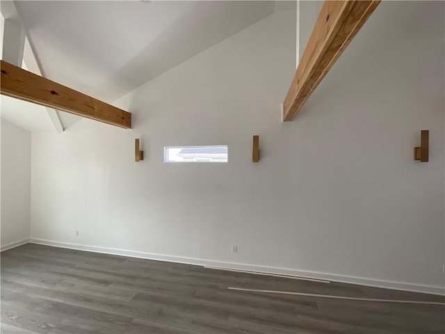 spare room with dark hardwood / wood-style flooring, high vaulted ceiling, and beam ceiling