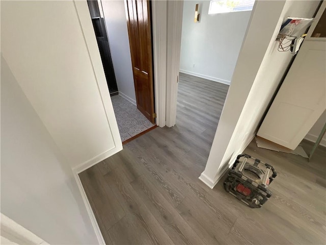 corridor with dark hardwood / wood-style floors