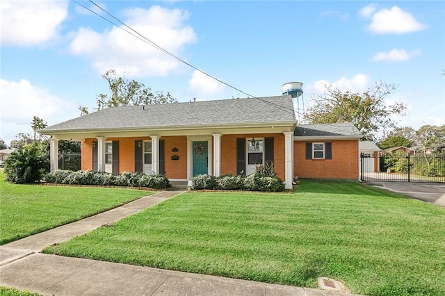 view of front of property featuring a front yard and covered porch