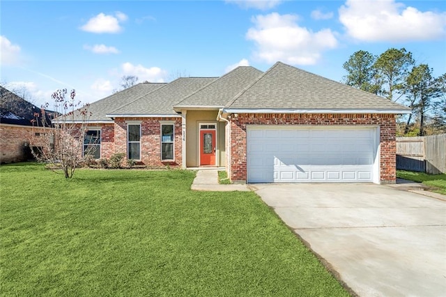 view of front of house featuring a garage and a front lawn