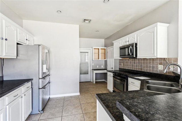 kitchen featuring sink, stainless steel appliances, and white cabinets