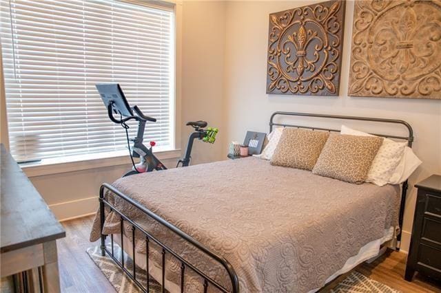 bedroom with hardwood / wood-style flooring