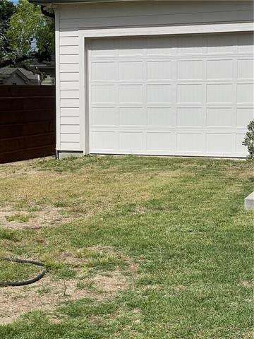 garage featuring a yard