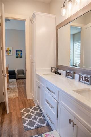 bathroom with vanity and hardwood / wood-style flooring