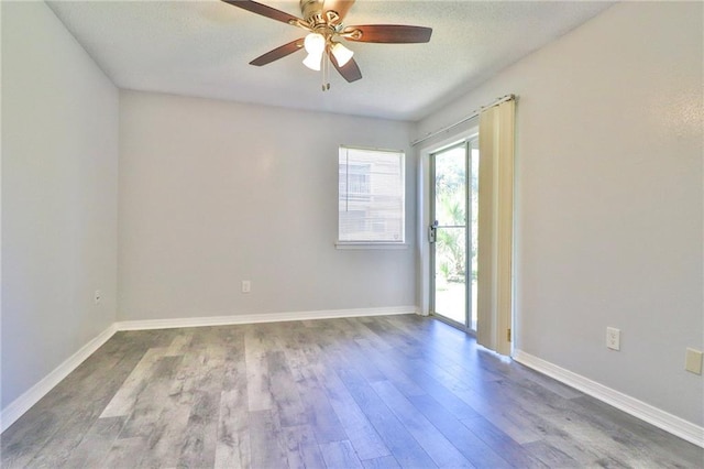 unfurnished room with wood-type flooring and ceiling fan