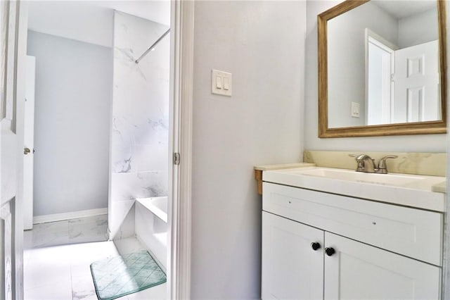 bathroom featuring vanity and  shower combination