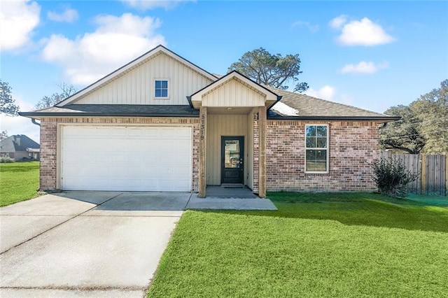 view of front facade with a garage and a front yard