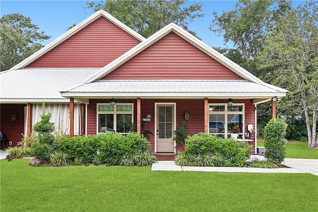 view of front of home with a front yard and a porch