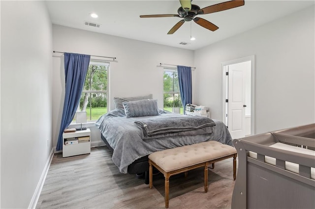 bedroom featuring wood-type flooring and ceiling fan