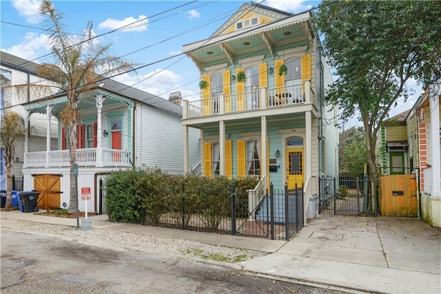 italianate house with a balcony and a porch