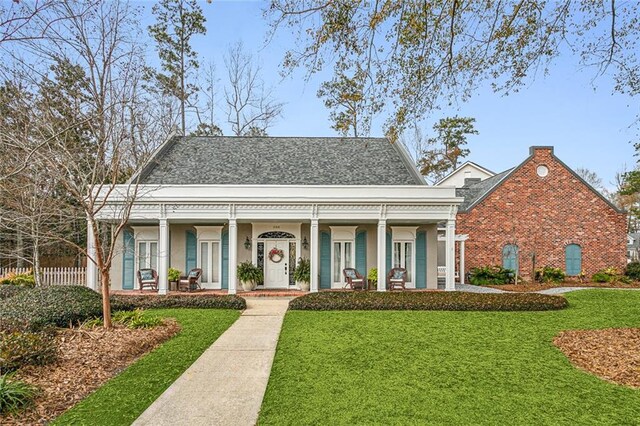 view of front of home featuring a porch and a front lawn