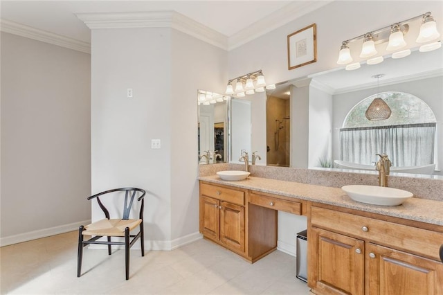 full bath with double vanity, ornamental molding, a sink, and baseboards