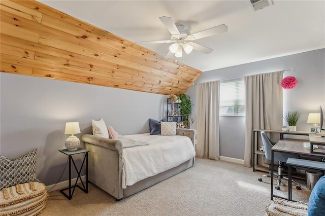 carpeted bedroom with a ceiling fan, lofted ceiling, visible vents, and baseboards