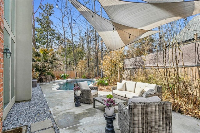 view of patio / terrace with an outdoor living space, a fenced backyard, and a fenced in pool