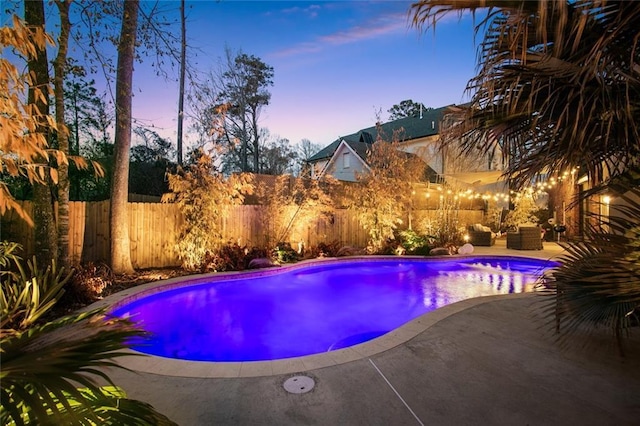 view of swimming pool featuring a patio area, a fenced backyard, an outdoor living space, and a fenced in pool