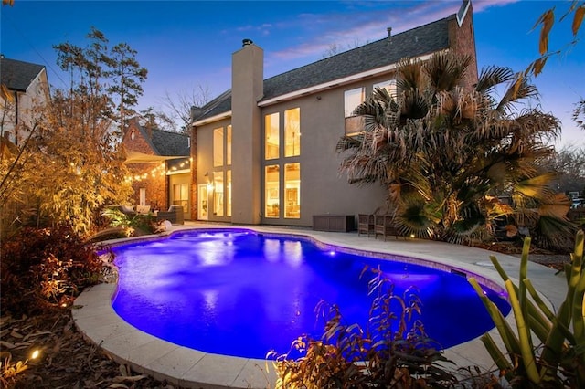 outdoor pool featuring a patio