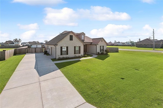 view of front of home featuring a garage and a front lawn