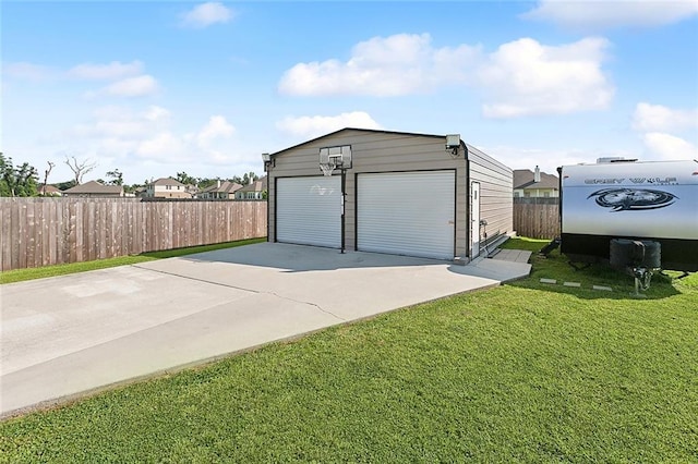 garage featuring a yard