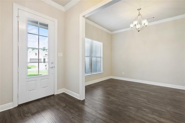 doorway featuring crown molding, dark hardwood / wood-style flooring, and a chandelier