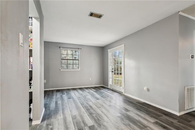 unfurnished room with hardwood / wood-style floors