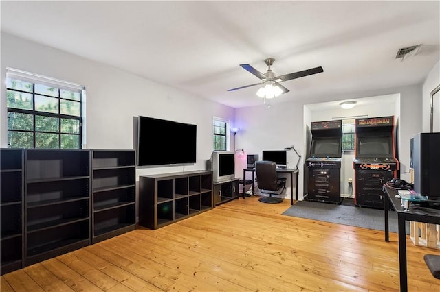 office space with hardwood / wood-style floors and ceiling fan