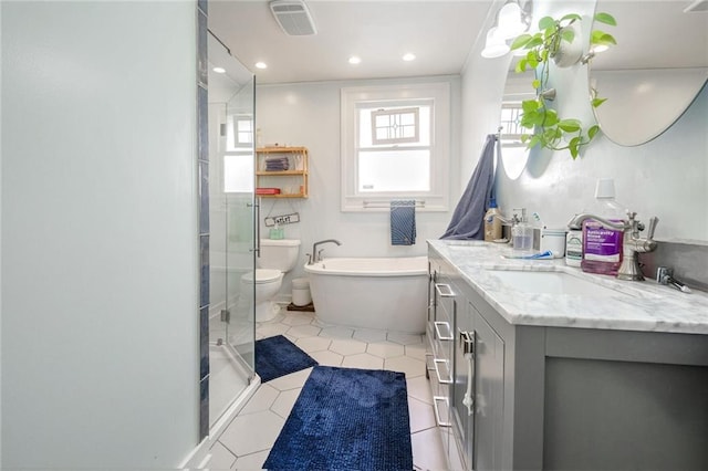 full bathroom featuring vanity, tile patterned floors, independent shower and bath, and toilet