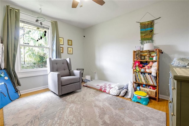 interior space featuring light hardwood / wood-style floors and ceiling fan