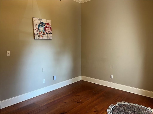 7 Bluebird St, New Orleans, LA 70124 - spare room featuring baseboards and dark wood-style flooring