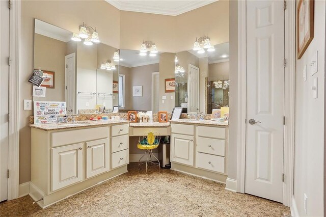 bathroom featuring ornamental molding and vanity