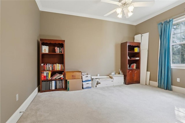 misc room featuring ceiling fan, ornamental molding, and light carpet