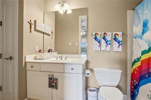 bathroom with vanity, walk in shower, and toilet