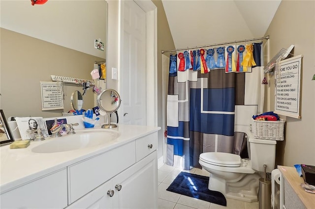 bathroom with tile patterned flooring, vanity, toilet, and walk in shower