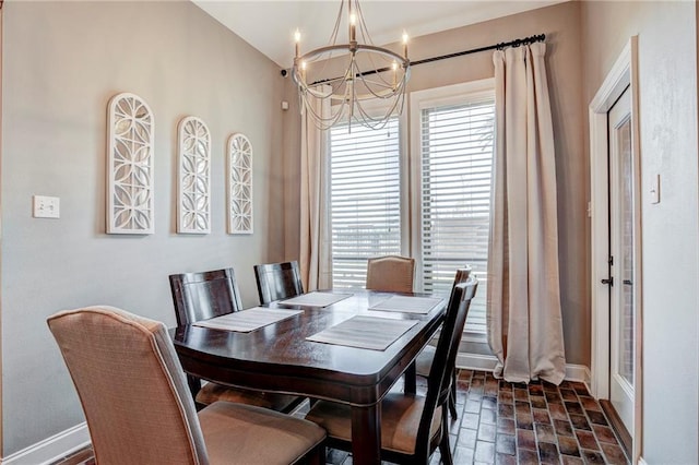 dining room with a chandelier and a healthy amount of sunlight