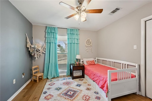 bedroom with hardwood / wood-style flooring and ceiling fan