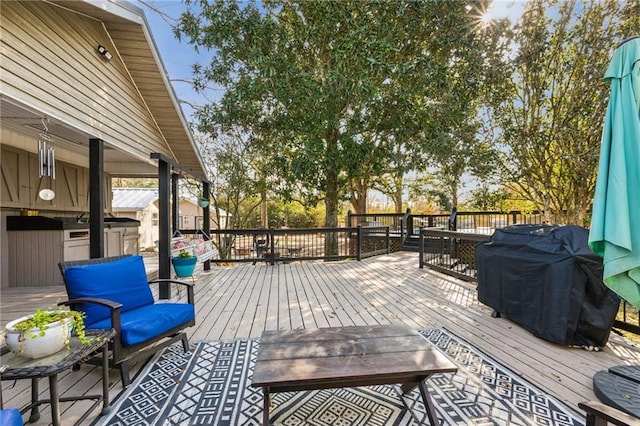 wooden deck with grilling area