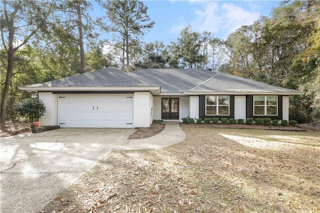 ranch-style house featuring a garage