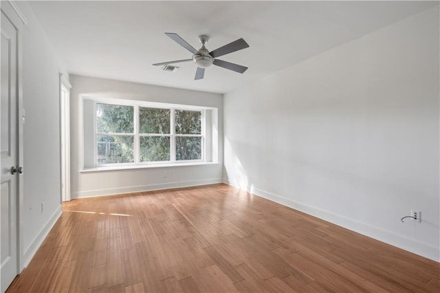 unfurnished room with light hardwood / wood-style floors and ceiling fan