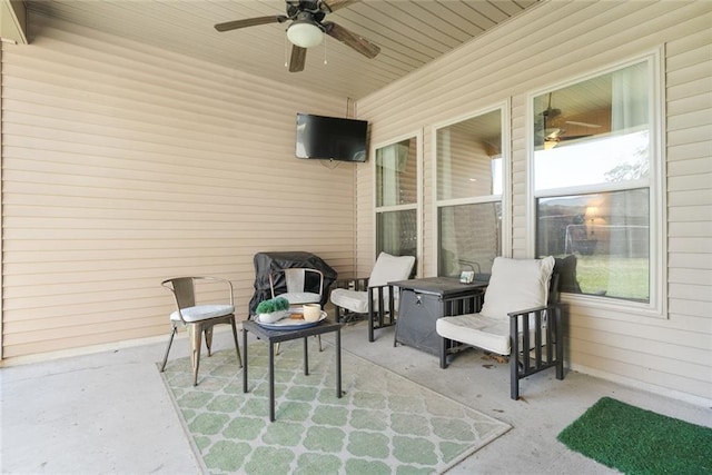 view of patio featuring ceiling fan