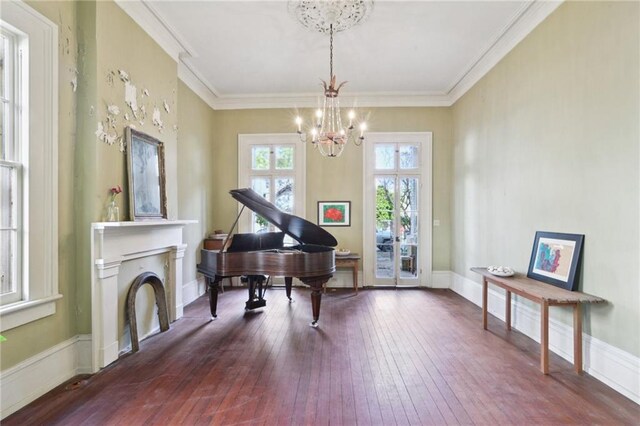 172224 Delachaise St, New Orleans, LA 70115 - living area featuring a chandelier, hardwood / wood-style flooring, and crown molding
