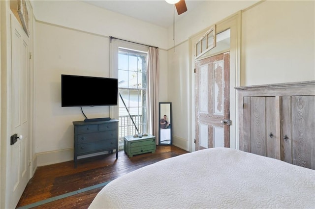 bedroom with dark wood-type flooring and ceiling fan