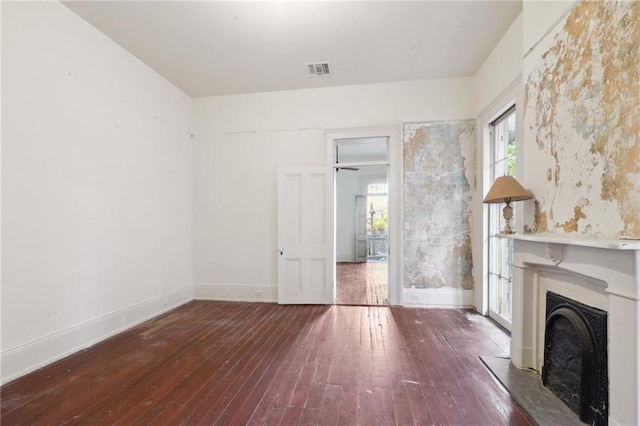 unfurnished living room with wood-type flooring