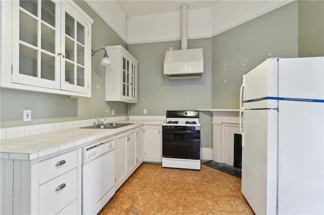 kitchen featuring sink, ventilation hood, tile counters, white appliances, and white cabinets