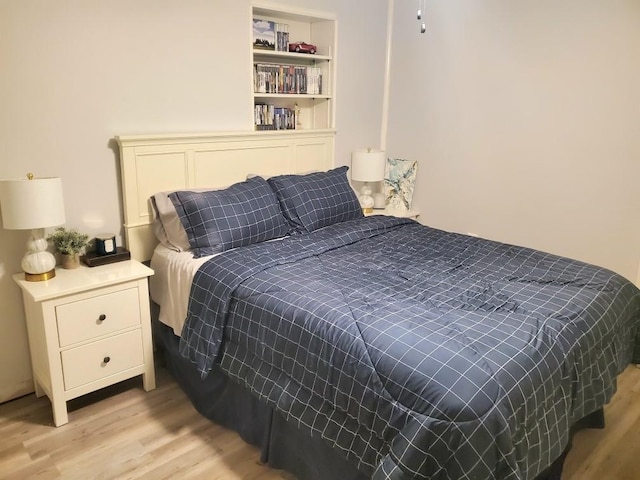 bedroom with light hardwood / wood-style floors