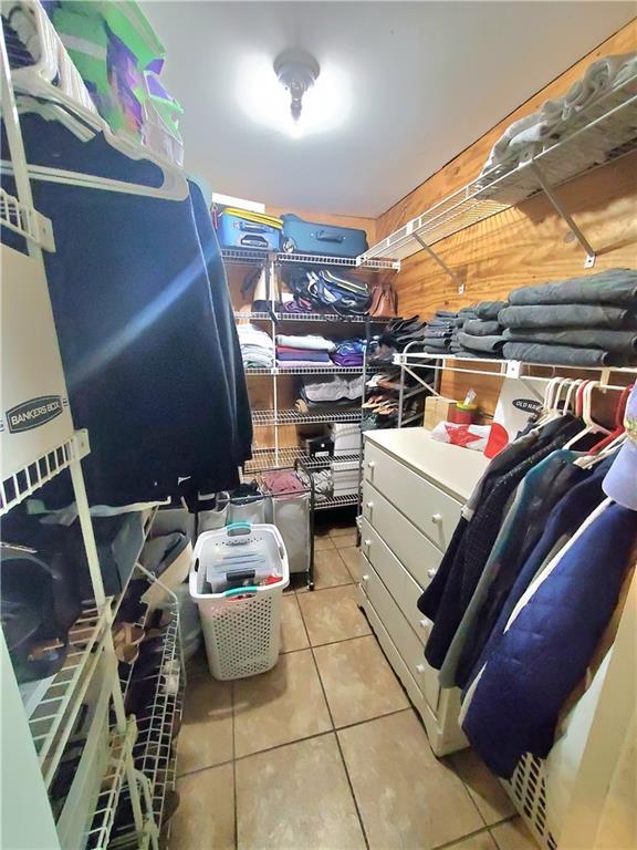 9028 Camille Ave, River Ridge, LA 70123 - spacious closet featuring light tile patterned flooring