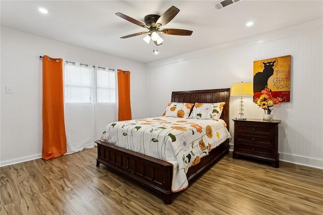 bedroom featuring hardwood / wood-style floors and ceiling fan