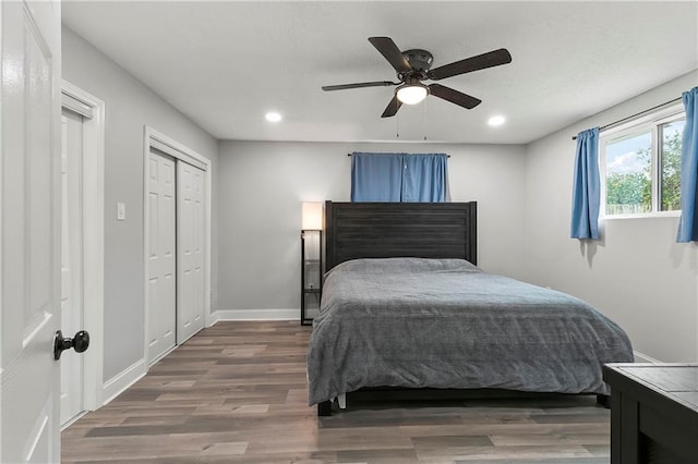 bedroom featuring ceiling fan and dark hardwood / wood-style flooring