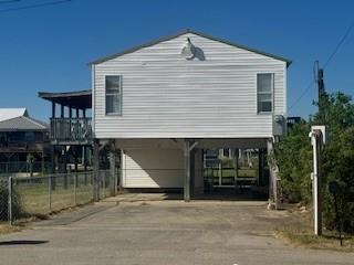 view of side of home with a carport